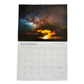 Calendar with a November layout featuring a celestial scene and volcano.