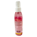 Pink spray bottle with a label on a white background