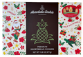 Honolulu Cookie Company packaging with Christmas-themed designs on a white background