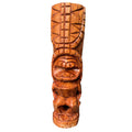 Wooden tiki mask with intricate carvings on a white background