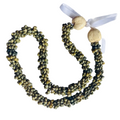 Green mongo shell beaded necklaces with wooden kukui beads on a white background