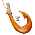 Wooden fish hook with a rope on a white background