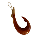 Wooden fish hook with a rope on a white background