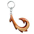 Wooden fish hook keychain on a white background