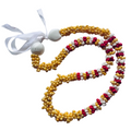 Beaded necklace with white, red, and yellow pattern on a white background