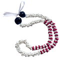 Two beaded necklaces, one white and one red and white, on a white background.