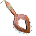 Wooden tool with a handle and metallic spikes on a white background