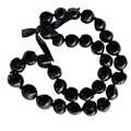 Black beaded kukui necklace on a white background
