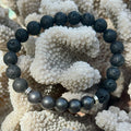 Black beaded bracelet on a piece of white coral