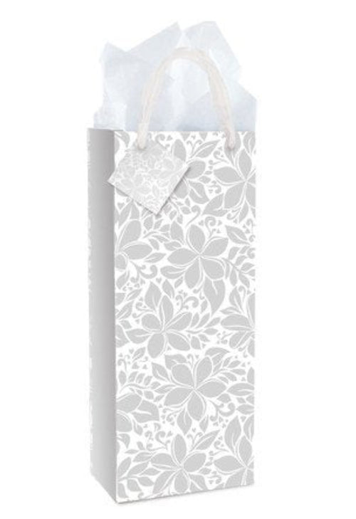 Elegant plumeria wine gift bag by Island Heritage with chiffon handles and gift tag