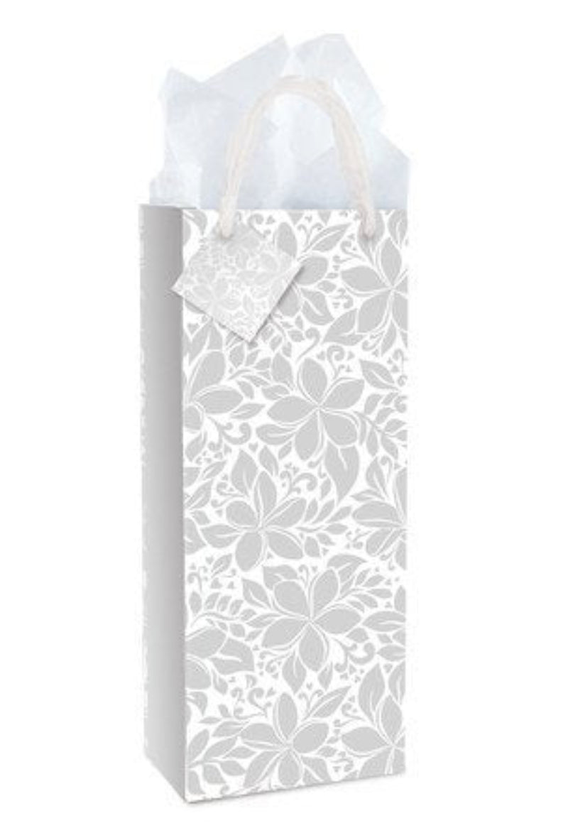 Elegant plumeria wine gift bag by Island Heritage with chiffon handles and gift tag