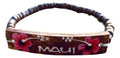 A coconut shell bracelet with hand-painted flowers and the text 'MAUI' on it.