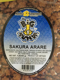 Two 1 lb bags of Big Island Sakura Arare rice crackers by Aloha Gourmet with blue packaging and soy-glazed Japanese-style rice cracker mix inside