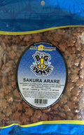 Two 1 lb bags of Big Island Sakura Arare rice crackers by Aloha Gourmet with blue packaging and soy-glazed Japanese-style rice cracker mix inside
