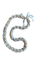 Braided cowry shell lei with a white ribbon 