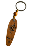 Wooden Surfboard Keychain with Honu and the word Maui